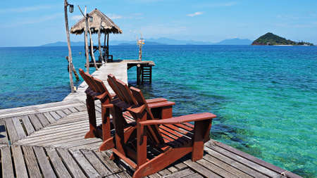 Wooden chairs on seaside.の写真素材