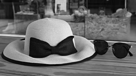 Female vintage hat and sunglasses in black and white background.の写真素材