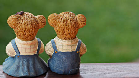Lovely bear couple with their backs turn. Valentine or anniversary background.の写真素材
