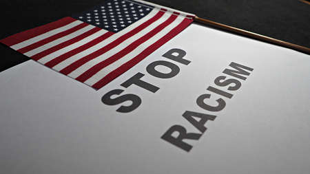 Stop racism, text message with American flag. Banner for protest or human rights action.の写真素材