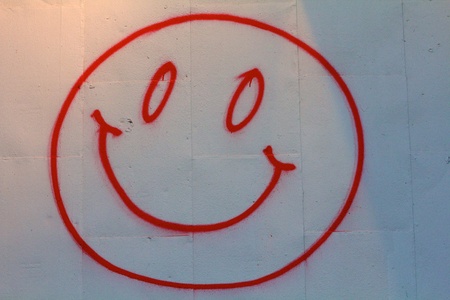 Red smiley face on white backgroundの写真素材