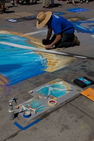 Denver Chalk Art Fest 2014, man working on gull wingのeditorial素材