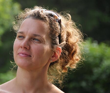 Portrait of a woman in the sunlight.の写真素材