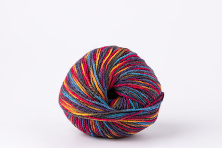 Multicolor yarn ball on white background, clean and minimalist style with copy space. Concept of...
