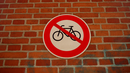 Bicycle stop sign. Bicycle ban. Sign on the wall. Stop or ban sign with bicycle. No bicyclesのeditorial素材