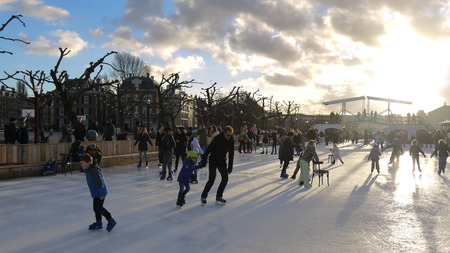 Ice skating stock image. Ice skating in city. Winter Amsterdam photoのeditorial素材