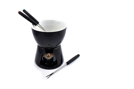 Fondue stock images. Fondue set on a white background. Black ceramic fondue setの写真素材