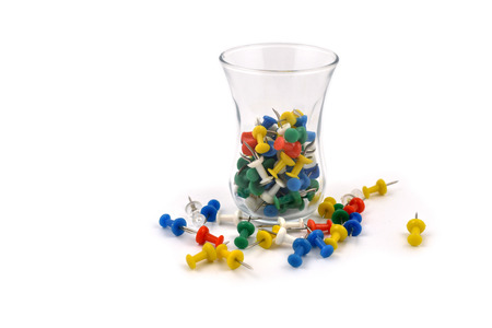 Thumbtacks in a glass stock images. Tack on a white background. Multicolor plastic tacks. Set of...