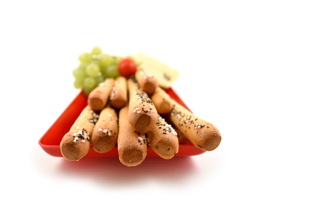 Salty sticks with garnish stock images. Salty sticks on a white background. Salty snack on a red...