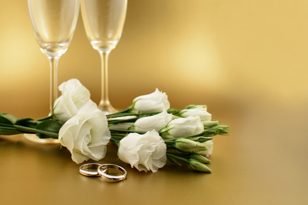 Golden wedding background stock images. White flowers with a ring. Valentines Day concept. White romantic bouquet images. Lisianthus, Eustoma Grandiflorum. Tender white bouquetの写真素材