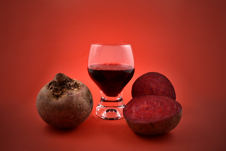 Beetroot juice stock images. Vegetable juice with red beet. Beetroot on a red backgroundの写真素材