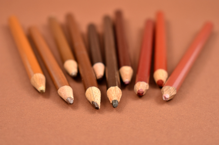 Brown crayons stock images. Set of brown crayons on a brown background. Art supplies imagesの写真素材