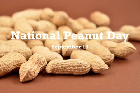 Peanut Day illustration. Peanuts on brown background stock images. Pile of Peanuts with Nutshell....