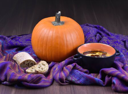 Pumpkin soup stock images. Bowl of pumpkin soup with bread. Pumpkin soup still life. Fresh homemade pumpkin soup stock imagesの写真素材