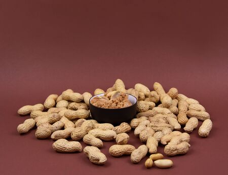 Peanut Butter stock photography Peanuts on brown background stock images. Pile of Peanuts with...
