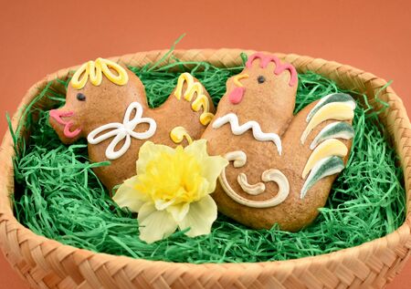 Basket with Easter gingerbreads stock images. Easter decoration with gingerbread images. Gingerbread...
