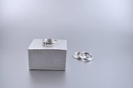 Engagement Ring or Wedding Ring stock images. Ring in gift box. Propose day concept. Diamond wedding ring gift stock images. Wedding silver backgound with copy space for textの写真素材