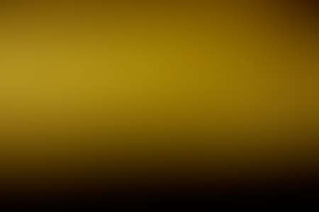 Golden black blurred abstract background stock images. Abstract dark gold metal gradient images. Shiny festive background with copy space for textの写真素材