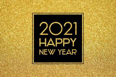 2021 Happy New Year shiny golden background frame stock images. 2021 New Year sign on a golden...