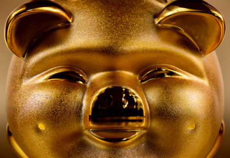 Golden saving piggy bank. Shiny pig money box. Cheerful chinese gold piggyの写真素材