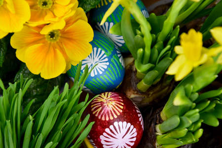 Beautiful hand painted easter eggs with spring flowers close-up stock images. Easter decoration with...