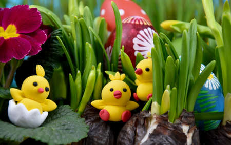 Cute easter baby chicks toys and fresh spring flowers stock images. Little yellow chickens easter...