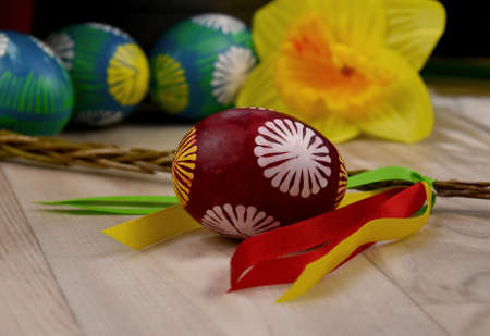 Beautiful hand painted easter eggs stock images. Easter decoration with colored eggs and easter whip...