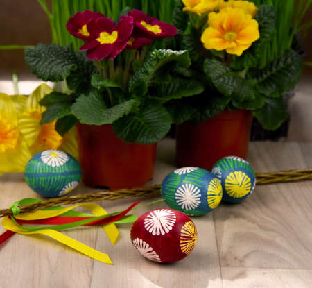 Beautiful hand painted easter eggs stock images. Easter decoration with colored eggs, easter whip...
