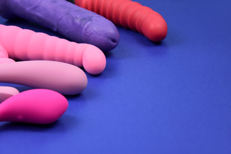 Vibrator sex toys for women on a blue background stock photo images. Set of erotic vaginal toys images. Dildo and vibrators on a blue background with copy spaceの写真素材