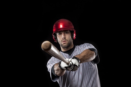 Baseball Player on a black background. Studio Shot.