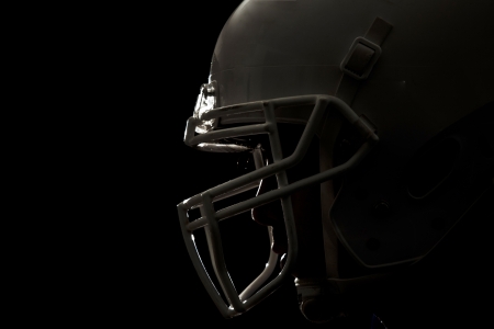 Football Player with number on a blue uniform and a ball in the hand  Studio shot の写真素材