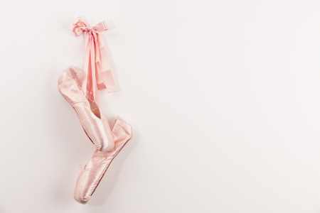 Pink Ballet shoes on white background.の写真素材