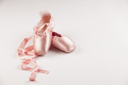 Pink Ballet shoes on white background.の写真素材