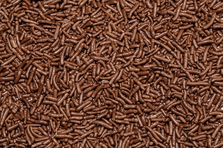 Chocolate sprinkles background.の写真素材