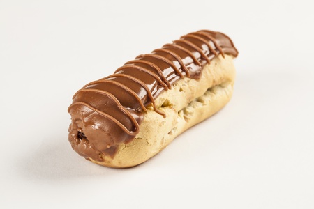 Bomba de chocolate. A Brazilian traditional eclair on a white background.の写真素材