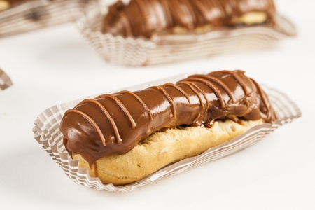 Bomba de chocolate. A Brazilian traditional eclair on a white background.の写真素材