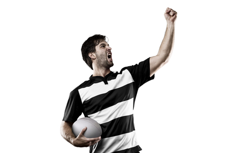 Rugby player in a Black and white uniform celebratingの写真素材