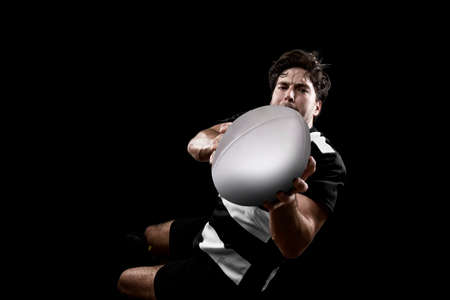 Rugby player in a black and white uniformの写真素材