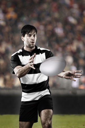 Rugby player in a black and white uniformの写真素材