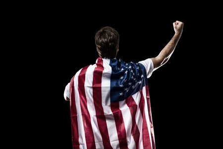 American soccer player, celebrating on the black background.の写真素材