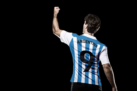 Argentinian soccer player, celebrating on the black background.の写真素材
