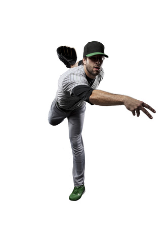 Baseball Player, pitcher, in a Green uniform, on a white background.の写真素材