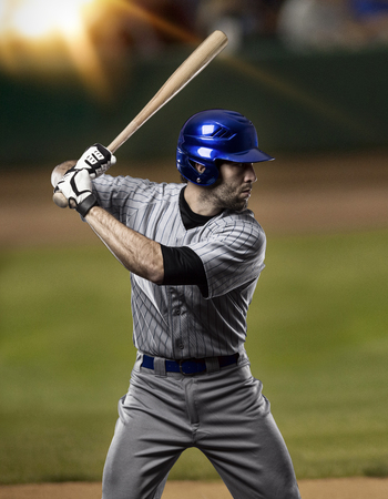 Baseball Player on a Blue Uniform on baseball Stadium.
