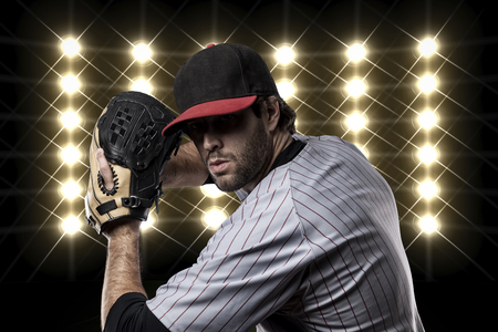 Baseball Player in front of lights.