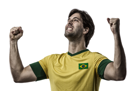 Brazilian soccer player, celebrating on a white background.の写真素材