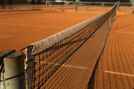 Clay (Dirt) Tennis Court, under the sunset.の写真素材