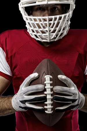 Close up of a Football Player with a red uniform on a Black background.の写真素材