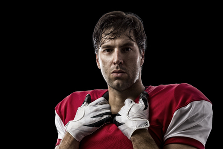 Football Player with a red uniform on a Black background.の写真素材