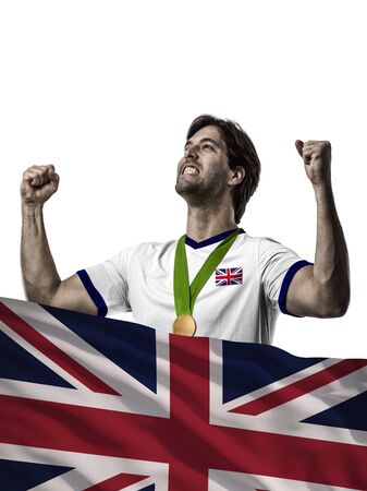 British Athlete Winning a golden medal with a British flag in front.の写真素材