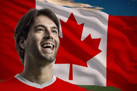 Canadian Athlete in front of a Canadian flag.の写真素材